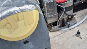 Sliding gate motor opened for repair and maintenance showing internal components